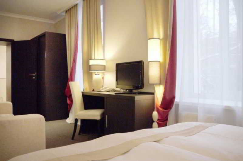 Optima Collection Kharkiv Hotel Стая снимка